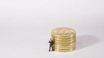 Business man figure standing in front of  bitcoin. Bitcoin mining concept. photo