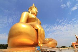 Big Buddha image on blue sky background photo