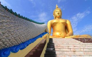 Big Buddha image on blue sky background photo