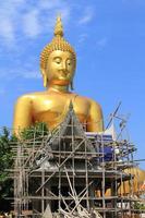 Big Buddha image on blue sky background photo