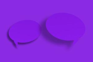 Purple paper in the shape of speech bubbles against a purple background. Communication bubbles. photo