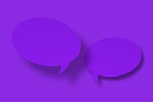 Purple paper in the shape of speech bubbles against a purple background. Communication bubbles. photo