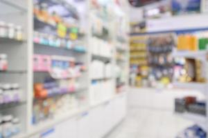 farmacia farmacia desenfoque de fondo abstracto con medicamentos y productos vitamínicos en los estantes foto