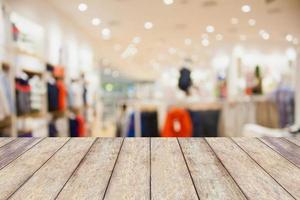 Empty table and blur clothing store with bokeh background photo