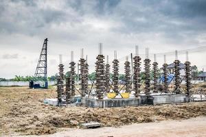 installation of cement formwork frames to new house construction at building site, real estate development photo