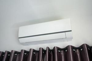 Air conditioner on wall in modern house room photo