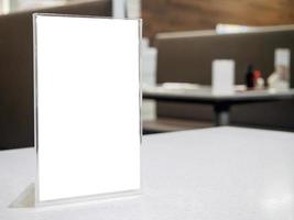 Mock up menu frame on table in the cafe restaurant photo