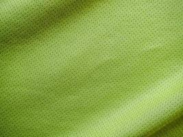 textura de jersey de tela de ropa deportiva verde foto