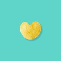 heart shape potato chips on pastel blue background photo