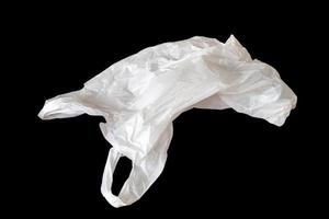 white plastic bag isolated on black background photo