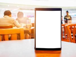 Mock up Blank white menu frame on cafe restaurant table photo