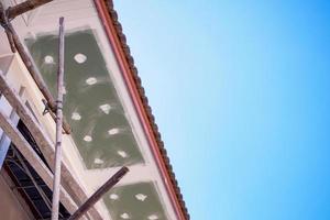 Soffit and Fascia Board Installation at House Building Construction Site photo