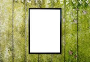 blank poster photo frame on wood wall