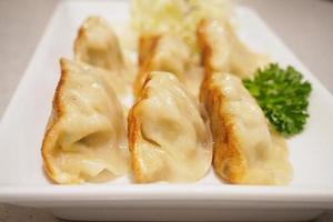 Gyoza dumplings with vegetables photo