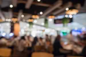 People in restaurant cafe interior with bokeh light blurred customer abstract background photo