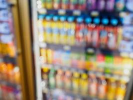 supermarket refrigerator shelves with beverage products photo