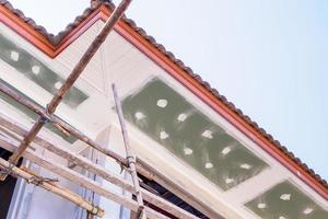 Soffit and Fascia Board Installation at House Building Construction Site photo