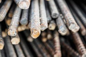 Deformed steel bars metal texture close up photo