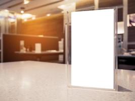 Mock up menu frame on table in the cafe restaurant photo