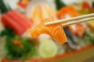 salmon sashimi with sashimi set background photo