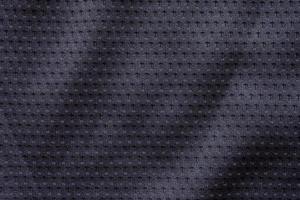 Black fabric sport clothing football jersey texture background photo