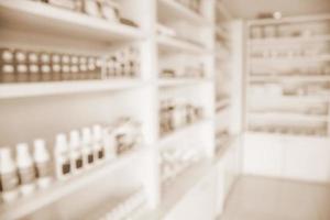 pharmacy shelves filled with medication blur background photo