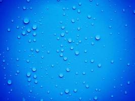 Water drops on blue background photo