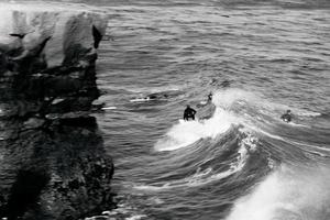 Black and white surfer on the waves photo