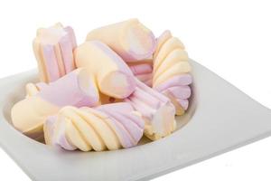 Marshmallow in a bowl on white background photo