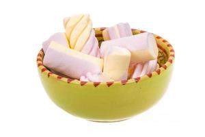 Marshmallow in a bowl on white background photo