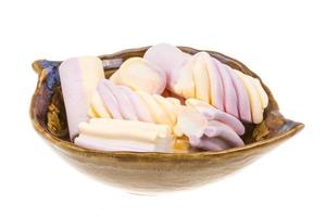 Marshmallow in a bowl on white background photo