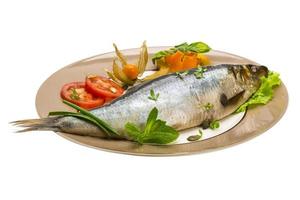 Ripe herring on a plate photo