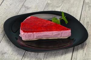 Soft Raspberry cheesecake served mint photo