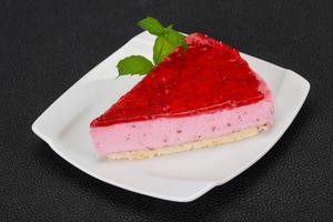 Soft Raspberry cheesecake served mint photo