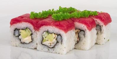 Maki Sushi - Roll made of Crab, avocado, cucumber inside. Fresh Tuna and tobico roe outside photo