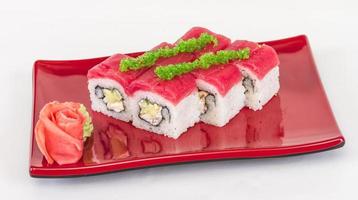 Maki Sushi - Roll made of Crab, avocado, cucumber inside. Fresh Tuna and tobico roe outside photo