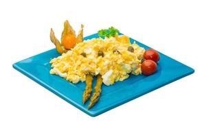 Scrambled eggs on white background photo