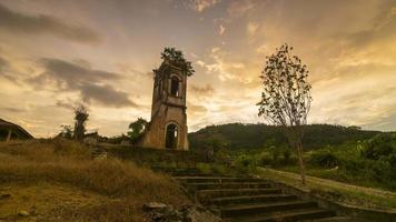 Timelapse vintage damaged church in the sunset hour w video