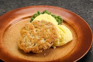 Chicken cutlet with mashed potato photo