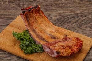 Smoked pork ribs with spices photo