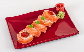 Japanese sushi traditional japanese food.Roll made of salmon, red cavair, roe and cream photo