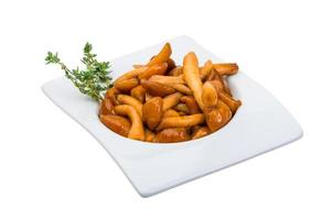 Armillaria in a bowl on white background photo