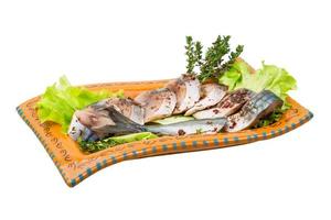 Mackerels on the plate and white background photo