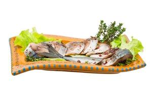 Mackerels on the plate and white background photo