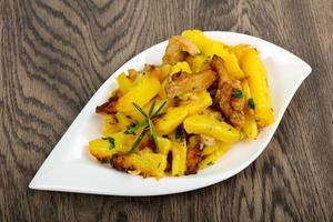 Fried potato with pork photo