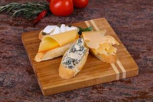 Bruschetta with various cheeses photo