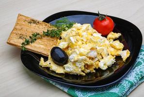 Scrambled eggs with tomato photo