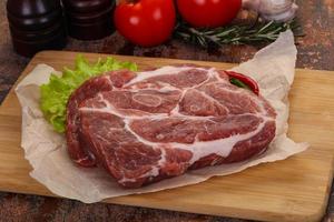 Raw pork neck steak photo