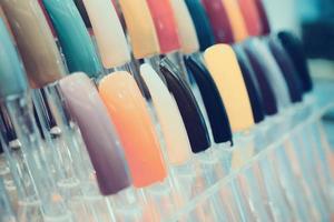 colorful artificial nails in beauty shop photo
