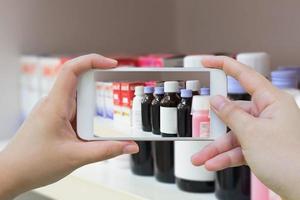 taking photo of medicine bottles in pharmacy store